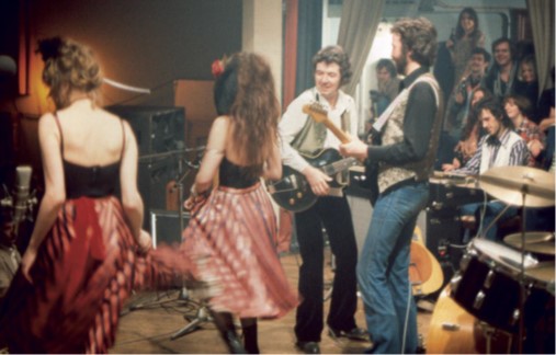 JFAM Photo - pg 39 Ronnie Lane Playing at Party with Eric Clapton and Dancers Photo Credit-