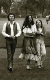 JFAM Photo - pg 56 Ronnie Lane with Woman and Child Passing Show BW photo credit-