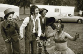 JFAM Photo - pg 57 Ronnie Lane Slim Chance Passing Show laughing with clowns BW photo credit-