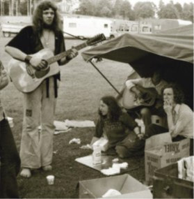 JFAM Photo - pg 61 Ronnie Lane Slim Chance Passing Show man with guitar BW photo credit-