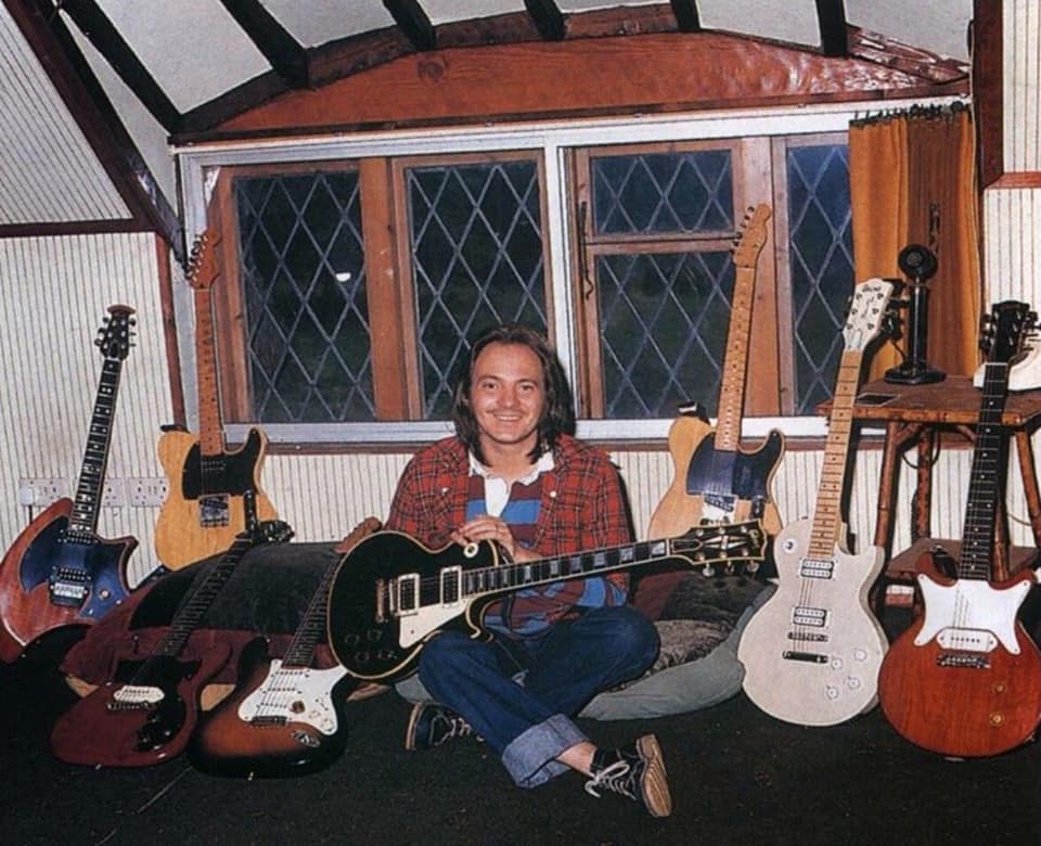 Steve Marriott  in room full of guitars date- photo credit-